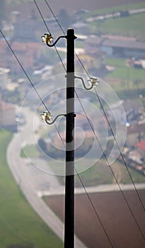 Light pole with three wires of the power line to supply electric