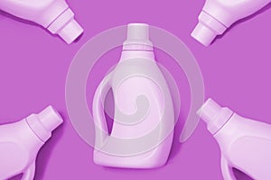 Light purple bottles on purple background. Cleaning concept