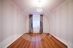 Light room with luster and window with curtains