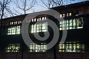 Light in windows of destroyed building. Old building