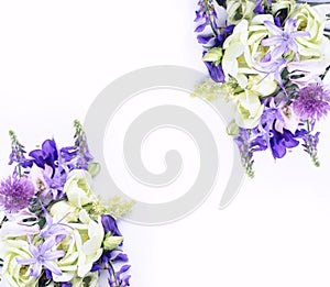 Light salad and lilac flowers in a festive delicate composition on a white background.