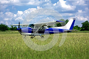 Light school airplane on grass