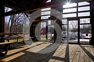 Light and shadow in the damaged barn house with lens flare