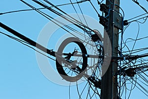 Light and shadow electric poles and electric wires located high on the sky background, selectable focus.