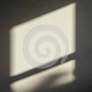 Light and shadow play on a wall forming a rectangular pattern