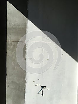 Light and Shadow on raw concrete or bare cement wall texture, Abstract white and grey colour background, Process building house