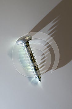 Light and shadows on a steel screw