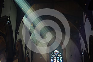 Light shafts stream into church window