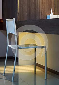 Light shape white soft colour chair in a resort hotel guest room