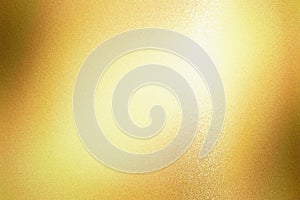 Light shining on gold foil glitter metallic wall with copy space  abstract texture background