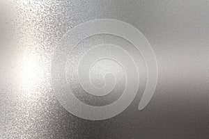 Light shining on rough chrome metal wall texture, abstract background