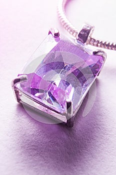 Light shining through a violet pendant