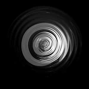 Light shining on white water ripple with black backdrop , abstract texture background