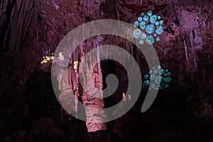 Light show stalactites in a cave