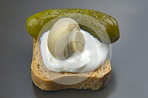 Light snack breakfast of canned and pickled cucumber, mushrooms with bread.  food and vegetables. diet and weight loss