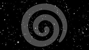 Light soft  snow falling isolated on black 4k seamless loop.  Place it over your footage in screen or add mode.