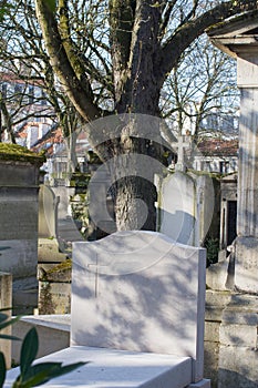 Light and spirituality on beautiful ancient cemetery at city graveyard