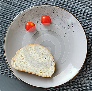 light summer breakfast tomatoes with bread on a plate