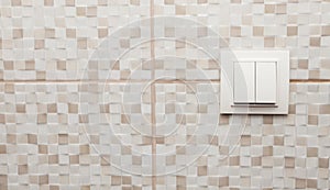 light swich on bathroom tile