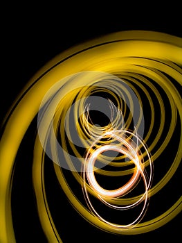 Light swirls on a black background, abstract