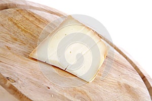 Light swiss cheese on wood