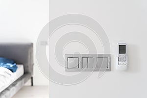 Light switch and air conditioner controller on wall