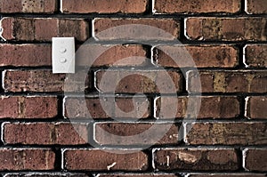 Light switch on a Brick wall
