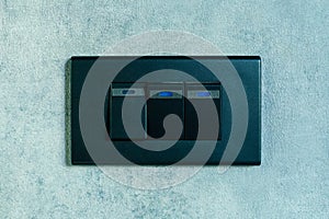 Light switch on concrete texture wall background