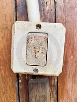 a light switch made of plastic that serves to turn on or turn off the light