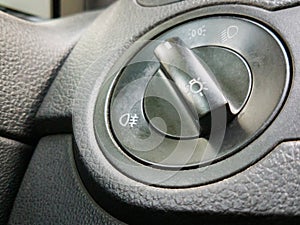 Light switch in modern car. Interior view