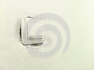 The light switch is in the off position