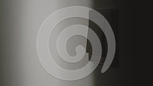 Light switch on the wall in the night