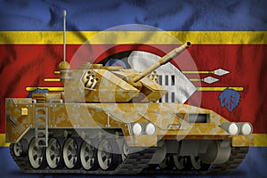 Light tank apc with desert camouflage on the Swaziland national flag background. 3d Illustration