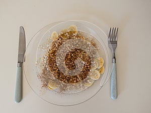 Light and tasty snack of sliced bananas with oats, sugar, cinnamon.