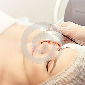 Light therapy procedure. Heal beauty treatment. Woman facial device. Anti age and wrinkle