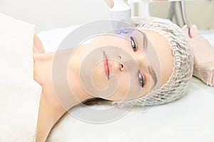 Light therapy procedure. Heal beauty treatment. Woman facial device. Anti age and wrinkle