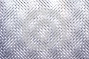 Light colored stainless steel industrial plate wall with diamond