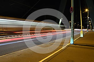 Light traces of cars on the Severin Bridge at night in Cologne, Germany, long exposure