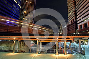 Light trail of BTS skytrain at night in Bangkok photo