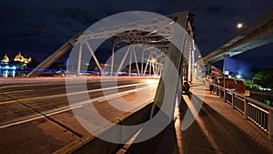 Light trail on Krungthep bridge at dusk in Bangkok