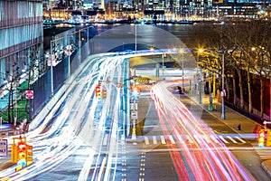 Light trails on the busy night streets, crossroad in big city