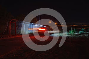 Light trails of car moving on the patrol road