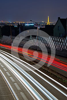 Light trails of cars arriving in Paris at night