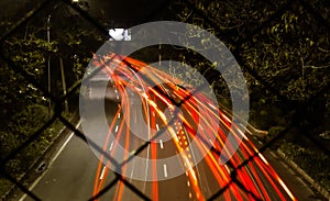 Light trails from cars crossing the street in cilegon