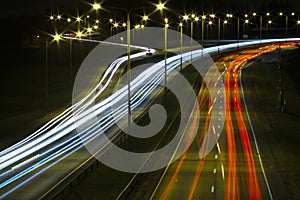 Light trails of cars on a highway at night