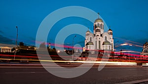 Light trails on the city street after sunset. Church of All Saints Yekaterinburg