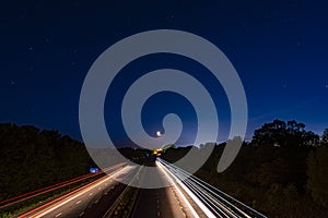 Light trails on the M6 with the Moon setting