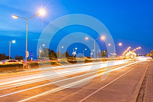 The light trails on the modern building background in chonburi Thailand