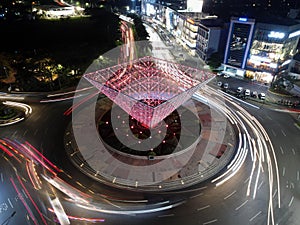 Light trails on motorway highway at night, long exposure abstract urban background at Bekasi. BEKASI. INDONESIA - NOVEMBER 22 2020