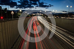 Light trails from speeding cars on the A40 highway in Perivale, London, UK, during the early evening